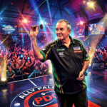 Phil Taylor throwing a dart on stage at the PDC World Championship